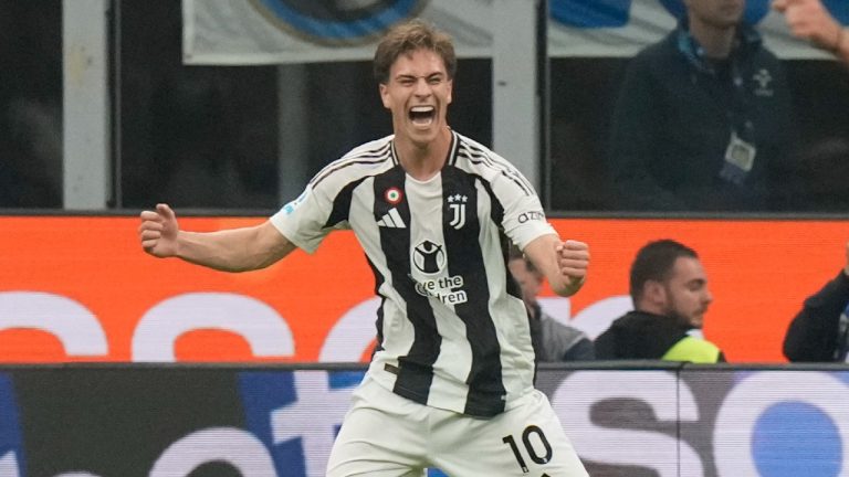 Juventus' Kenan Yildiz, left, celebrates after scoring his side's fourth goal during a Serie A soccer match between Inter Milan and Juventus at the San Siro stadium in Milan, Italy, Sunday, Oct. 27, 2024. (AP/Luca Bruno)