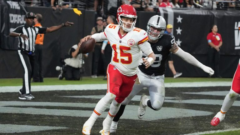 Kansas City Chiefs quarterback Patrick Mahomes (15) scrambles as Las Vegas Raiders defensive end Maxx Crosby (98) gives chase during the second half of an NFL football game Sunday, Oct. 27, 2024, in Las Vegas. (Rick Scuteri/AP Photo)