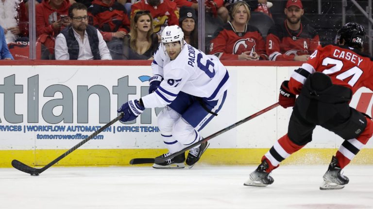 Toronto Maple Leafs left wing Max Pacioretty (67) controls the puck past New Jersey Devils defenseman Seamus Casey (24) during the first period of an NHL hockey game Thursday, Oct. 10, 2024, in Newark, N.J. (Adam Hunger/AP)