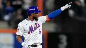 New York Mets' Starling Marte celebrates after a double against the Los Angeles Dodgers during the sixth inning in Game 5 of a baseball NL Championship Series. (Ashley Landis/AP)