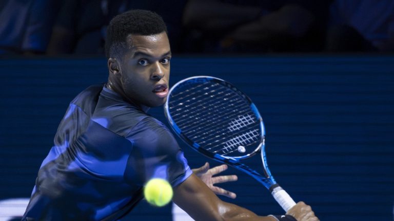 France's Giovanni Mpetshi Perricard returns a ball to United States's Ben Shelton during the final match at the Swiss Indoors tennis tournament at the St. Jakobshalle in Basel, Switzerland, Sunday, Oct. 27, 2024. (Georgios Kefalas/Keystone via AP)