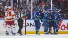 Canucks jump out to record four first-period goals in season-opener vs. Flames