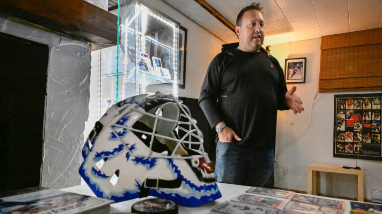 Nordiques fan and NHL souvenir collector Yan Marcil, pictured with memorabilia in his basement in Quebec City, Wednesday, Oct. 2, 2024. (Jacques Boissinot/CP)