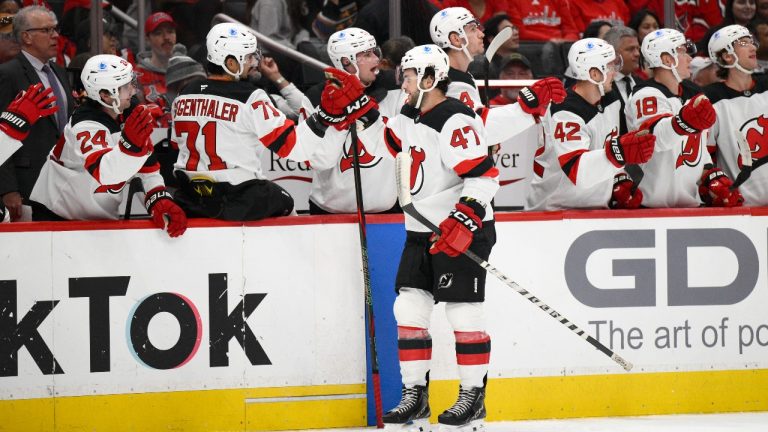 New Jersey Devils center Paul Cotter (47) celebrates his goal during the first period of an NHL hockey game against the Washington Capitals, Saturday, Oct. 12, 2024, in Washington. (AP Photo/Nick Wass)