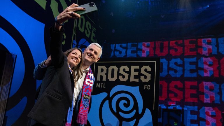 Founders Isabele Chevalier, left and Jean-Francois Crevier, take a selfie as the women's professional soccer franchise unveils the new logo and name for Montreal's Northern Super League team now known as Roses FC, in Montreal, Tuesday, Oct. 8, 2024. (CP/Christinne Muschi)