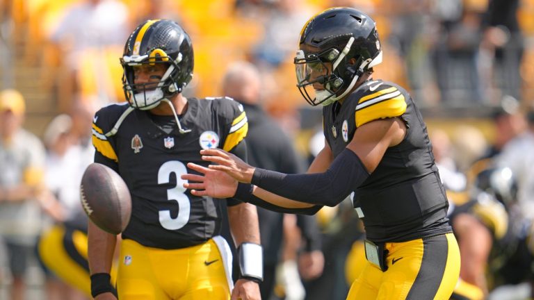 Pittsburgh Steelers quarterback Justin Fields, right, takes a snap as quarterback Russell Wilson (3) waits his turn during warm ups before an NFL football game against the Los Angeles Chargers in Pittsburgh, Sunday, Sept. 22, 2024. (Gene J. Puskar/AP Photo)