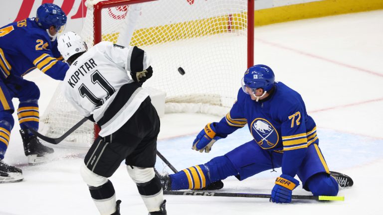 Los Angeles Kings centre Anze Kopitar (11) puts the puck past Buffalo Sabres centre Tage Thompson (72) for his third during the third period of an NHL hockey game Thursday, Oct. 10, 2024, in Buffalo, N.Y. (Jeffrey T. Barnes/AP)