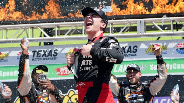 Sam Mayer celebrates in Victory Lane after his win in the NASCAR Xfinity Series auto race in Fort Worth, Texas, Saturday, April 13, 2024. (AP Photo/Larry Papke)