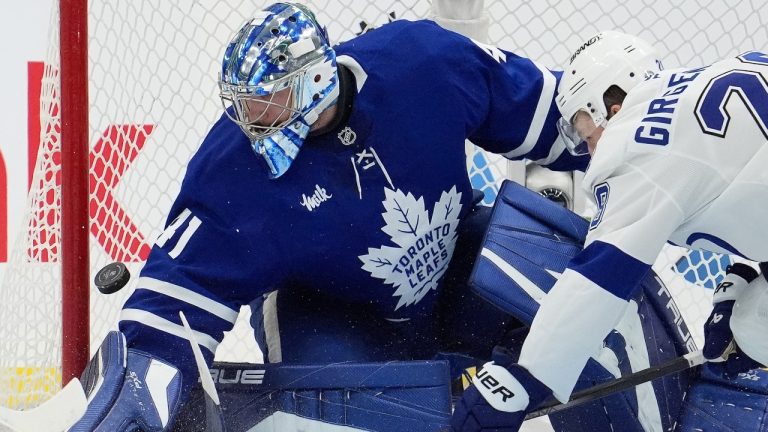 Tampa Bay Lightning centre Zemgus Girgensons (28) tries to get the puck past Toronto Maple Leafs goalie Anthony Stolarz (41) during second period NHL hockey action in Toronto, Monday, Oct. 21, 2024. (Frank Gunn/CP)