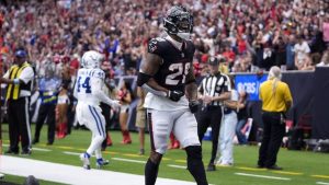 Houston Texans running back Joe Mixon (28) celebrates after a 14-yard touchdown run during the first half of an NFL football game against the Indianapolis Colts. (Tony Gutierrez/AP)