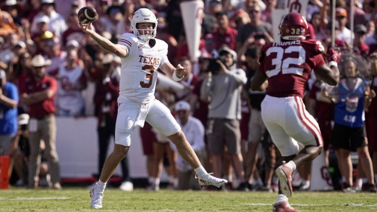 Texas quarterback Quinn Ewers (3) throws a pass under pressure from Oklahoma defensive lineman R Mason Thomas (32) in the first half of an NCAA college football game. (Tony Gutierrez/AP)
