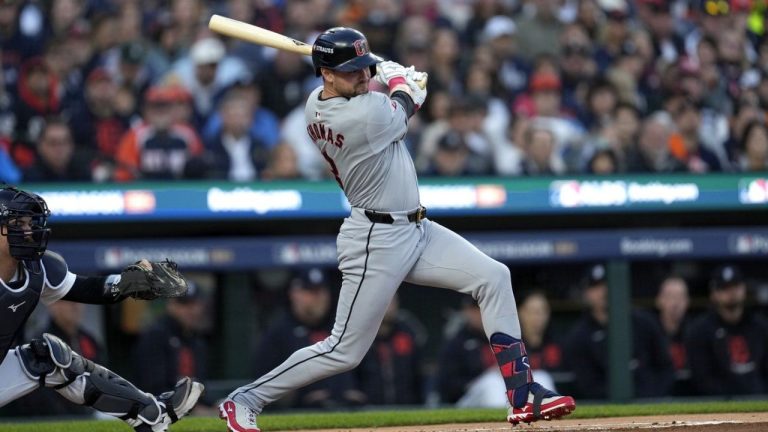 Cleveland Guardians' Lane Thomas hits an RBI single to score teammate Steven Kwan in the first inning during Game 4 of a baseball American League Division Series against the Detroit Tigers, Thursday, Oct. 10, 2024, in Detroit. (Paul Sancya/AP Photo)
