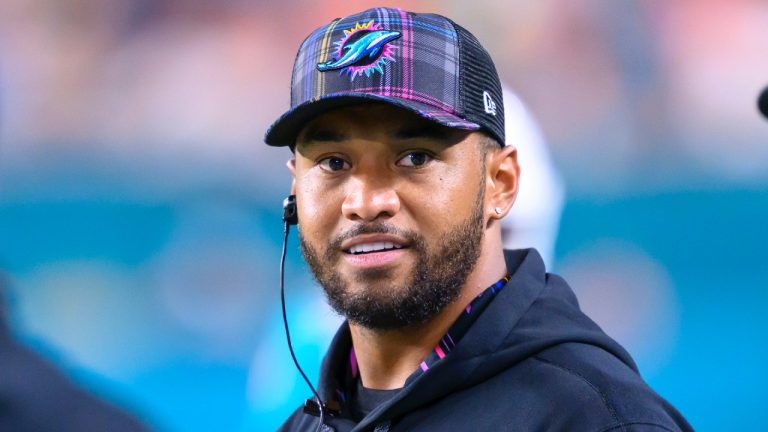 Miami Dolphins quarterback Tua Tagovailoa stands on the sidelines during an NFL football game against the Tennessee Titans, Monday, Sept. 30, 2024, in Miami Gardens, Fla. (Doug Murray/AP)