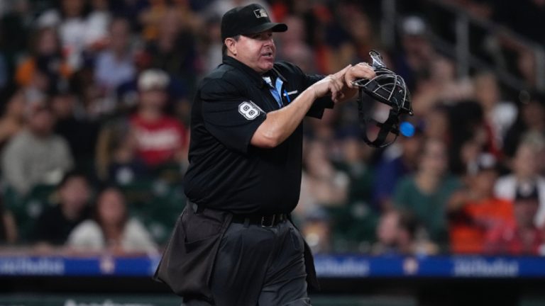 Umpire Doug Eddings calls a pitch clock violation during the seventh inning of a baseball game between the Houston Astros and the Los Angeles Angels, Friday, Sept. 20, 2024, in Houston. (Kevin M. Cox/AP)