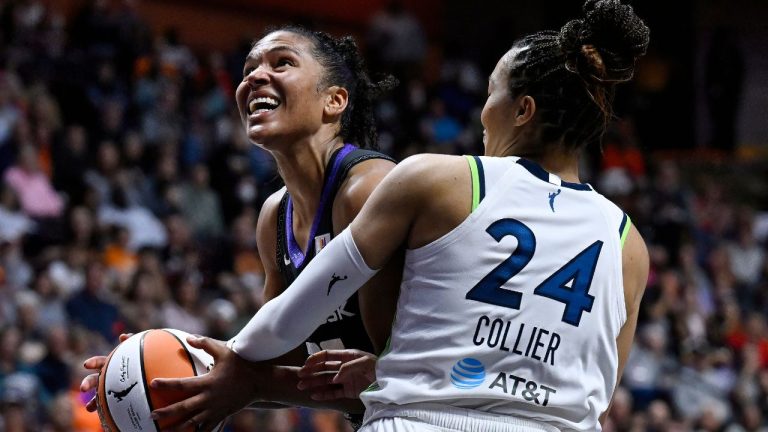 Minnesota Lynx forward Napheesa Collier (24) fouls Connecticut Sun forward Alyssa Thomas during the second half of Game 4 in the WNBA basketball semifinals, Sunday, Oct. 6, 2024, in Uncasville, Conn. (Jessica Hill/AP Photo)