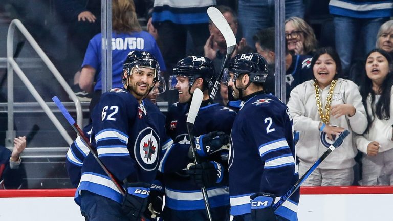 Winnipeg Jets' Nino Niederreiter (62), Nikolaj Ehlers (27) and Dylan DeMelo (2) celebrate Niederreiter’s goal against the Calgary Flames during first period NHL pre-season action in Winnipeg on Wednesday, October 2, 2024. THE CANADIAN PRESS/John Woods