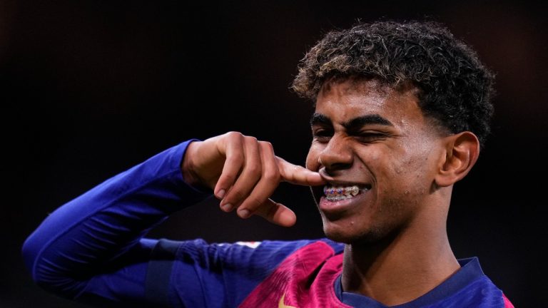 Barcelona's Lamine Yamal celebrates after scoring his side's third goal during a Spanish La Liga soccer match between Real Madrid and Barcelona at the Santiago Bernabeu stadium in Madrid, Spain, Saturday, Oct. 26, 2024. (AP/Manu Fernandez)