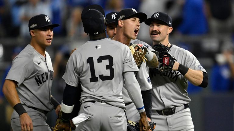 New York Yankees relief pitcher Luke Weaver yells as he celebrates with teammates after defeating the Kansas City Royals 3-1 in Game 4 of an American League Division baseball playoff series and move on to the ALCS Thursday, Oct. 10, 2024, in Kansas City, Mo. (Reed Hoffmann/AP Photo)