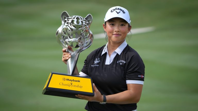 Yin Ruoning of China holds the winning trophy during the awards ceremony after winning the LPGA Tour's Maybank Championship at Kuala Lumpur Golf and Country club in Kuala Lumpur, Sunday, Oct. 27, 2024. (Vincent Thian/AP)