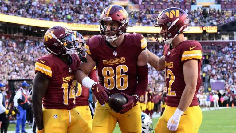 Washington Commanders tight end Zach Ertz (86) celebrates with teammates. (Nick Wass/AP)