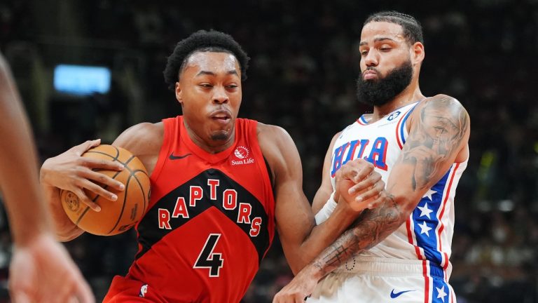 Toronto Raptors forward Scottie Barnes (4) drives at Philadelphia 76ers forward Caleb Martin (16) during first half NBA basketball action in Toronto on Friday, October 25, 2024. (Frank Gunn/THE CANADIAN PRESS)