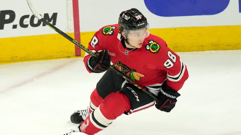 Chicago Blackhawks' Connor Bedard keeps his eyes on the puck during an NHL hockey game against the Minnesota Wild on Friday, Oct. 4, 2024, in Chicago. (Charles Rex Arbogast/AP)