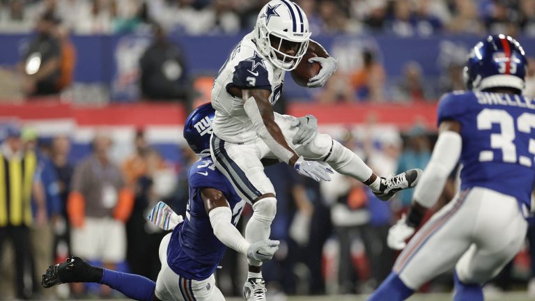 Dallas Cowboys wide receiver Brandin Cooks (3) tries to avoid a tackle from New York Giants safety Tyler Nubin (31) during the first quarter of an NFL football game. (Adam Hunger/AP)