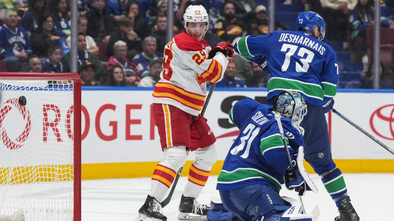 Flames battle back to defeat Canucks in overtime