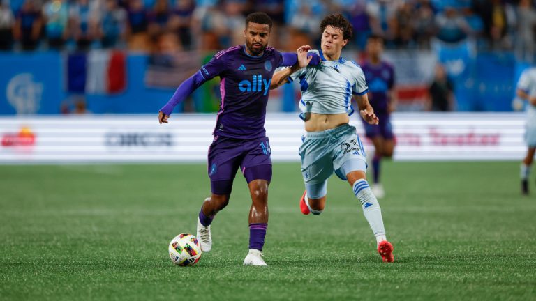 Charlotte FC defender Nathan Byrne, left, controls the ball against CF Montréal midfielder Caden Clark (23) during the second half of an MLS soccer match in Charlotte, N.C., Saturday, Oct. 5, 2024. Charlotte FC won 2-0. (Nell Redmond/AP)