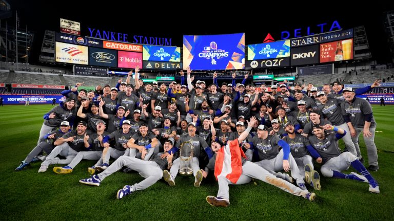 The Los Angeles Dodgers pose for a team picture after their win against the New York Yankees in Game 5 to win the baseball World Series, Thursday, Oct. 31, 2024, in New York. (Ashley Landis/AP)