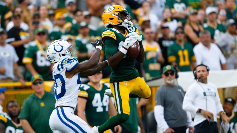 Green Bay Packers wide receiver Romeo Doubs (87) leaps for a catch against Indianapolis Colts cornerback Jaylon Jones (40) during a NFL football game. (Jeffrey Phelps/AP)