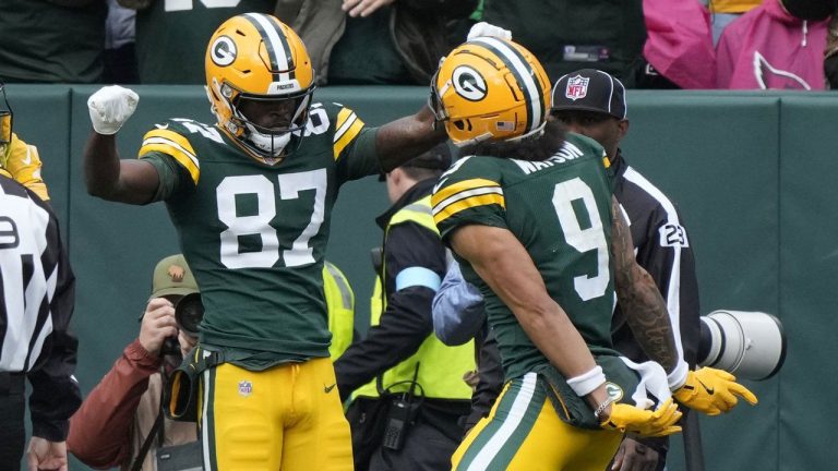 Green Bay Packers wide receiver Romeo Doubs (87) celebrates his 20-yard reception for a touchdown with teammate wide receiver Christian Watson during the second half of an NFL football game against the Arizona Cardinals. (Morry Gash/AP)
