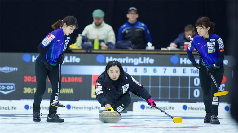 Satsuki Fujisawa (centre) shoots a stone during the HearingLife Tour Challenge on Tuesday, Oct. 1, 2024, in Charlottetown. (Anil Mungal/GSOC)