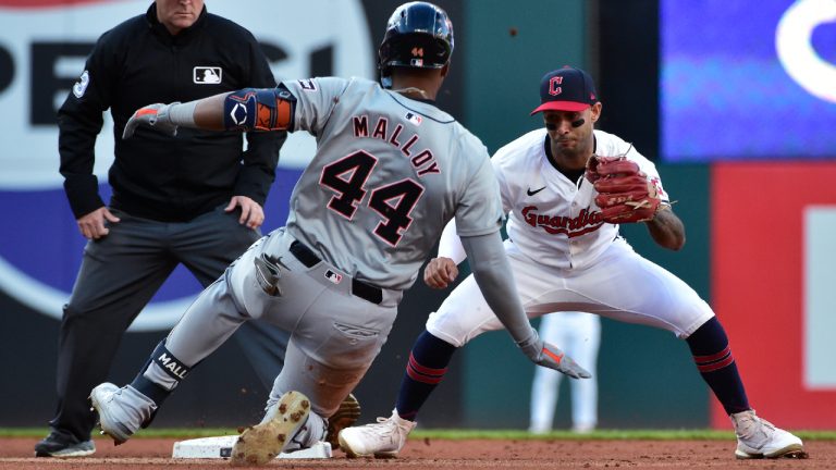 Cleveland Guardians shortstop Brayan Rocchio, right, prepares to tag out Detroit Tigers' Justyn-Henry Malloy (44) as Malloy attempts to stretch a single into a double in the fifth inning during Game 2 of baseball's AL Division Series, Monday, Oct. 7, 2024, in Cleveland. (Phil Long/AP)