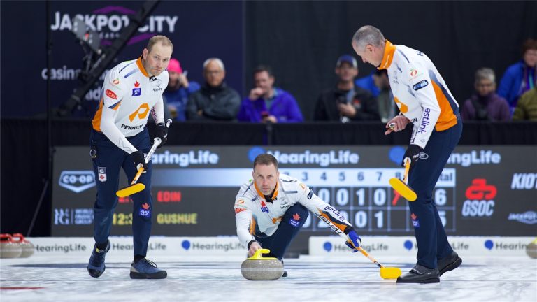 Brad Gushue (centre) shoots a stone as Geoff Walker (left) and E.J. Harnden (right) prepare to sweep during the HearingLife Tour Challenge on Wednesday, Oct. 2, in Charlottetown. (Anil Mungal/GSOC)