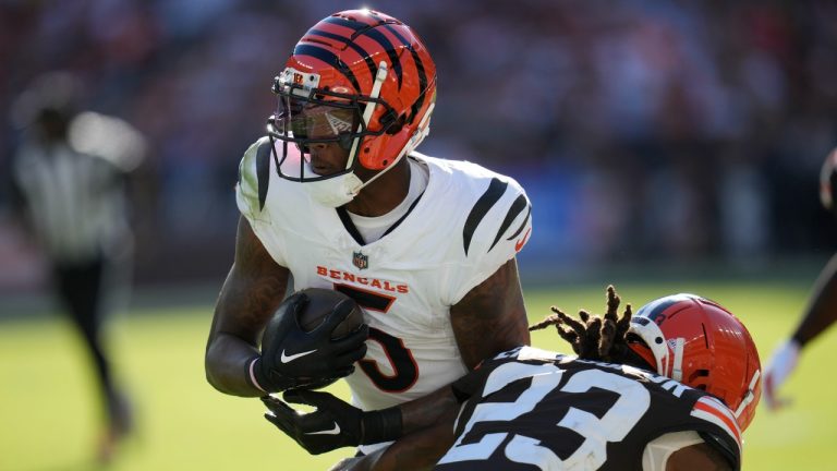 Cincinnati Bengals wide receiver Tee Higgins (5) carries against Cleveland Browns cornerback Martin Emerson Jr. (23) in the second half of an NFL football game, Sunday, Oct. 20, 2024, in Cleveland. (Sue Ogrocki/AP)