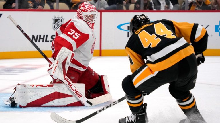 Detroit Red Wings goaltender Ville Husso (35) blocks a shot by Jonathan Gruden (44) during the second period of an pre-season NHL hockey game in Pittsburgh, Tuesday, Oct. 1, 2024. (Gene J. Puskar/AP)