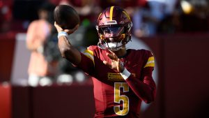 Washington Commanders quarterback Jayden Daniels warms up before an NFL game against the Carolina Panthers. (AP)