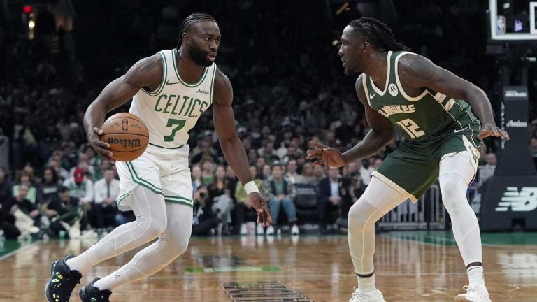 Boston Celtics' Jaylen Brown (7) drives past Milwaukee Bucks' Taurean Prince (12) during the first half of an NBA basketball game. (Michael Dwyer/AP)
