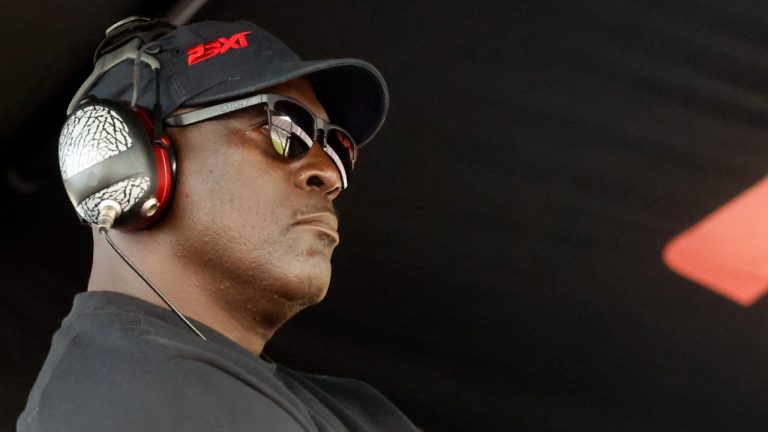 Michael Jordan, co-owner of 23XI Racing, sits in his pit box during a NASCAR Cup Series auto race at Talladega Superspeedway, Sunday, Oct. 6, 2024, in Talladega, Ala. (Butch Dill/AP)