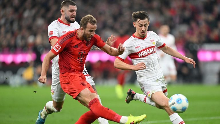 Munich's Harry Kane, left, plays against Stuttgart's Jeff Chabot during a German Bundesliga soccer match between FC Bayern Munich and VfB Stuttgart, in Munich, Germany, Saturday, Oct. 19, 2024. (Sven Hoppe/dpa via AP)