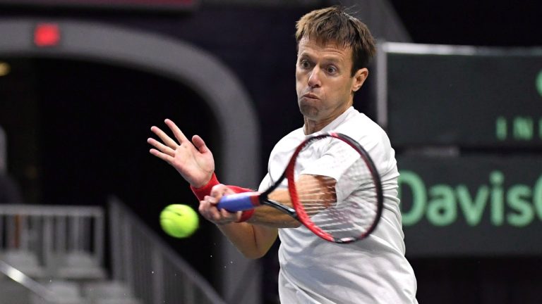 Daniel Nestor, of Canada, returns a shot from the team of Matwe Middelkoop and Jean-Julien Rojer, of the Netherlands, in Davis Cup doubles tennis action in Toronto on Saturday, September 15, 2018. (Jon Blacker/CP)