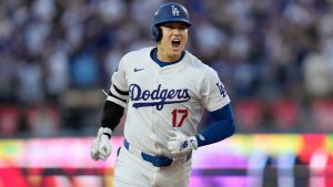 Los Angeles Dodgers' Shohei Ohtani reacts as he rounds the bases after his three-run home run during the second inning in Game 1 of baseball's NL Division Series against the San Diego Padres, Saturday, Oct. 5, 2024, in Los Angeles. (Ashley Landis/AP)