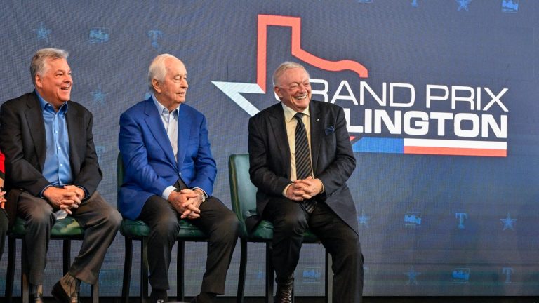 Texas Rangers chief operating officer Neil Leibman, left, IndyCar owner Roger Penske, centre, and Dallas Cowboys team owner Jerry Jones look on during a news conference announcing the IndyCar Grand Prix of Arlington to be held in 2026 in Arlington, Texas, Tuesday, Oct. 8, 2024. (Jerome Miron/AP)