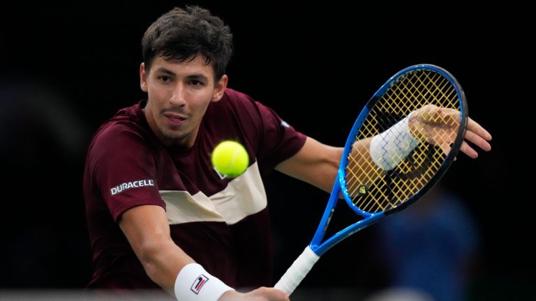 Alexei Popyrin, of Australia backhands to Russia's Daniil Medvedev during their second round match of the Paris Masters tennis tournament, Wednesday, Oct. 30, 2024 in Paris. (Michel Euler/AP)