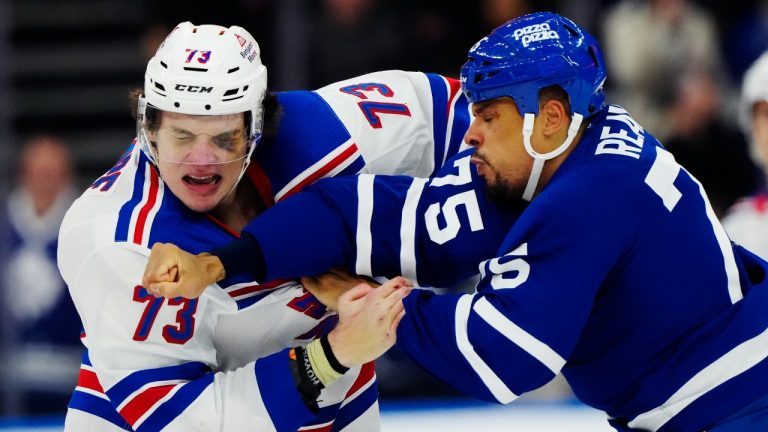 New York Rangers' Matt Rempe (73) and Toronto Maple Leafs' Ryan Reaves (75) fight during third period NHL hockey action in Toronto on Saturday, March 2, 2024. With roughly three weeks ticked off this season's schedule, there's been another early downward trend in fighting in the NHL. (Frank Gunn/CP)