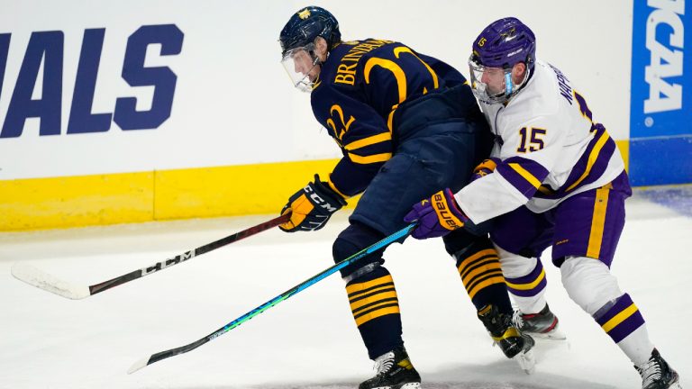 Quinnipiac forward Skyler Brind'Amour, left, battles for control of the puck as Minnesota State forward Julian Napravnik defends in the first period of an NCAA West Regional college hockey semifinal game Saturday, March 27, 2021, in Loveland, Colo. (David Zalubowski/AP)