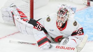 Ottawa Senators goaltender Linus Ullmark looks on after being scored on by Montreal Canadiens' Alex Newhook, not shown, during third period NHL hockey action in Montreal, Saturday, Oct. 12, 2024. (Graham Hughes/CP)