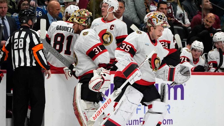 Ottawa Senators goaltender Linus Ullmark, right, skates out to the net to replace goaltender Anton Forsberg (31) who suffered an equipment failure in the second period of an NHL hockey game against the Colorado Avalanche. (David Zalubowski/AP)