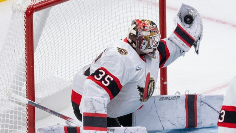 Ottawa Senators goaltender Linus Ullmark (35) makes a glove save during third period NHL pre-season hockey action against the Montreal Canadiens on Tuesday, Oct. 1, 2024 in Montreal. (Ryan Remiorz/CP)